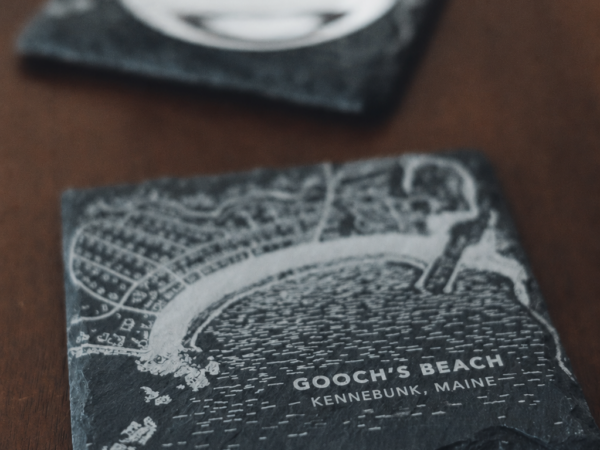 Laser engraved Gooch's Beach slate coaster featuring a detailed map of Kennebunk, Maine, set of 4